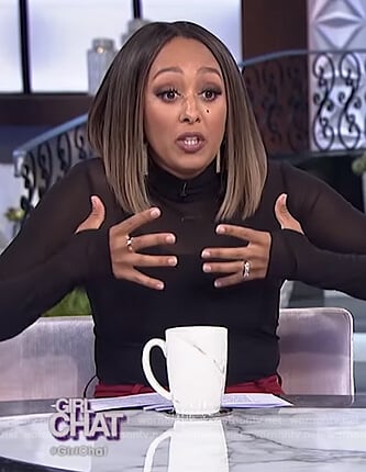 Tamera’s black sheer turtleneck top on The Real