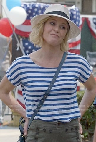 Claire’s striped tee and button detail pants on Modern Family