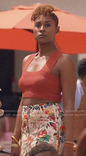 Issa’s orange crop top and floral skirt on Insecure