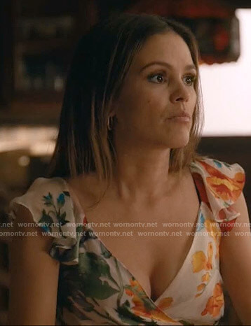 Sam’s white floral wrap top on Take Two