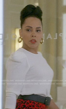 Tegan’s white puff-shoulder top and red leopard skirt on How to Get Away with Murder