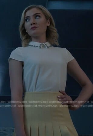 The Frost Sisters’ white embellished collar top and pleated mini skirt on The Gifted
