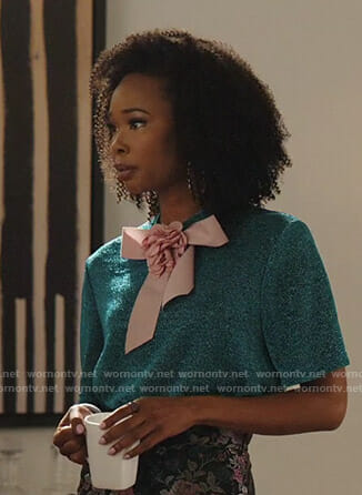 Monica’s metallic short sleeve top with bow on Dynasty
