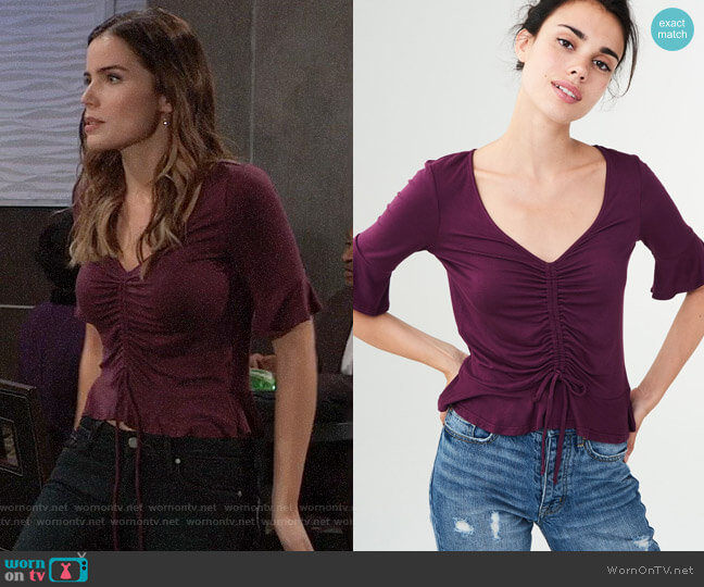 Aeropostale Solid Ruched Peplum Top worn by Sasha Gilmore (Sofia Mattsson) on General Hospital