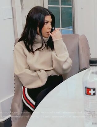 Kourtney’s beige cropped turtleneck sweater on Keeping Up with the Kardashians