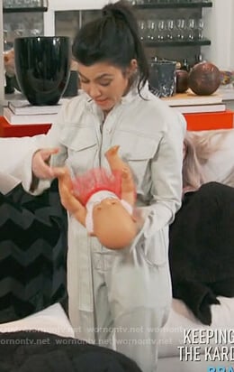 Kourtney’s white denim jumpsuit on Keeping Up with the Kardashians