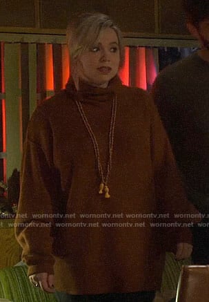 Kristin’s brown turtleneck sweater on Last Man Standing