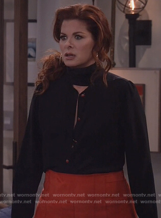Grace’s black tie neck blouse and red suede skirt on Will and Grace