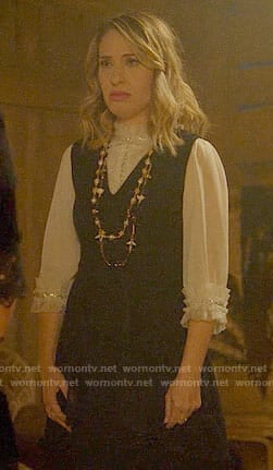Coco’s white ruffled top and black dress on American Horror Story: Apocalypse