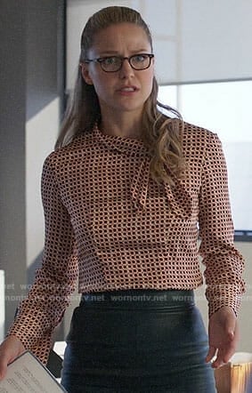 Kara’s geometric print tie-neck blouse on Supergirl