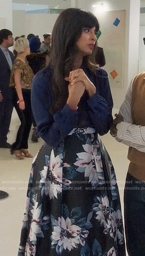 Tahani’s navy blouse and floral high-low skirt on The Good Place