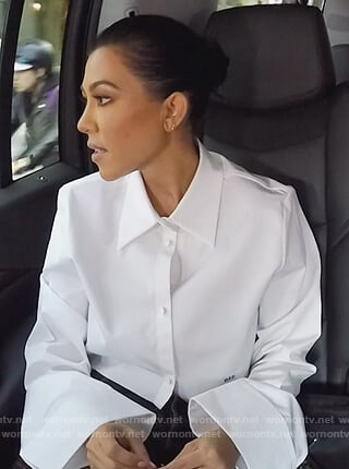 Kourtney’s white bell sleeve cropped top on Keeping Up with the Kardashians