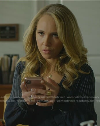 Veronica’s navy top with white stitching on Dirty John