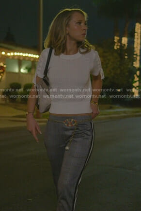 Veronica’s white lace-up sleeve top and plaid pants on Dirty John