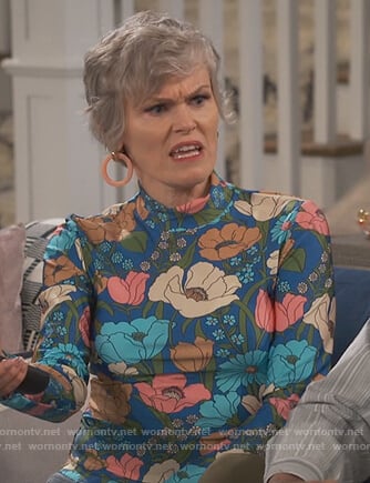 Bonnie’s blue floral mock neck top on Happy Together