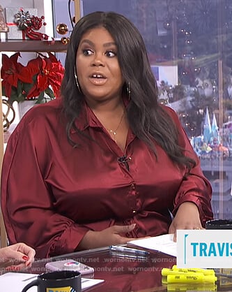 Nina’s burgundy satin jumpsuit on E! News Daily Pop