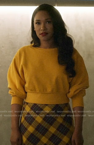 Iris’s yellow cropped sweatshirt and plaid skirt on The Flash