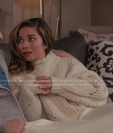 Alexis’s white chunky knit sweater on Schitt’s Creek