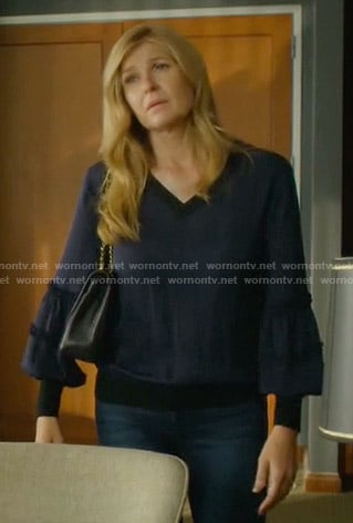Debra’s navy v-neck balloon sleeve top on Dirty John