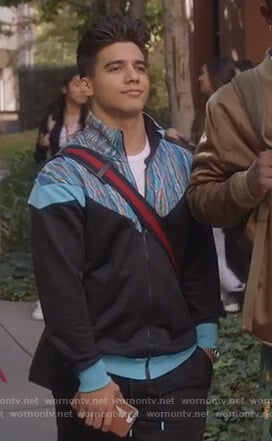 Vivek’s black and blue track jacket on Grown-ish