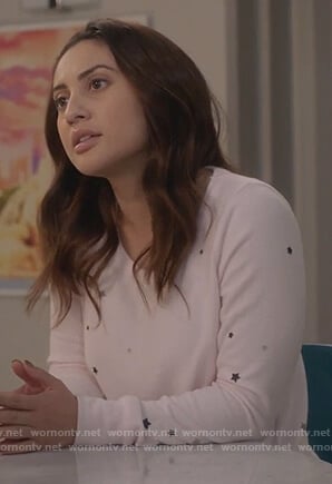 Ana’s pink star print sweatshirt on Grown-ish