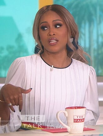 Eve’s white pleated top with waist stripes on The Talk