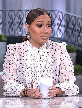 Adrienne’s white printed ruffled blouse on The Real