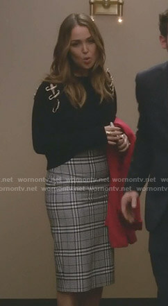 Jo’s black safety-pin detail sweater and checked pencil skirt on Grey’s Anatomy