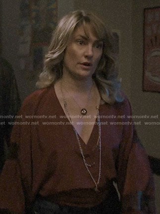 Alice’s burgundy blouse with lace insets on Riverdale