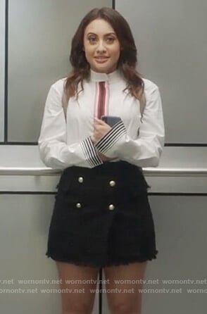 Ana’s white stripe blouse and black tweed mini skirt on Grown-ish