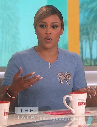 Eve’s blue palm tree embellished short sleeve sweater on The Talk
