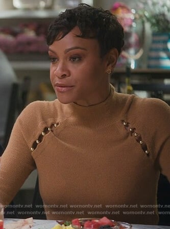 Angela’s brown cutout embellished sweater on American Housewife
