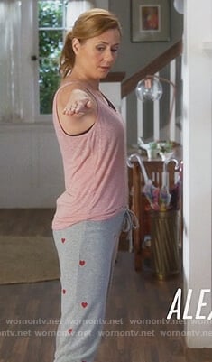 Lena’s gray heart print sweatpants on Splitting Up Together