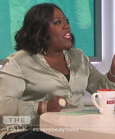 Sheryl’s green ruffle neck blouse on The Talk