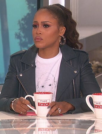 Eve’s white Picasso print tee and leather jacket on The Talk