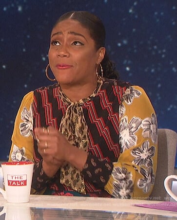 Tiffany Haddish’s mixed print tie neck dress on The Talk
