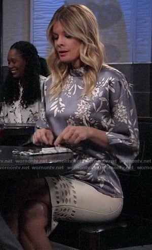 Nina’s blue-grey floral blouse and white cutout skirt on General Hospital