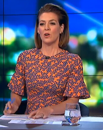 Gorgi’s orange floral bell cuff dress on The Project