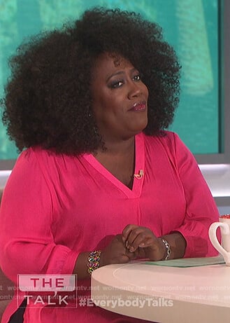 Sheryl’s pink v-neck blouse on The Talk