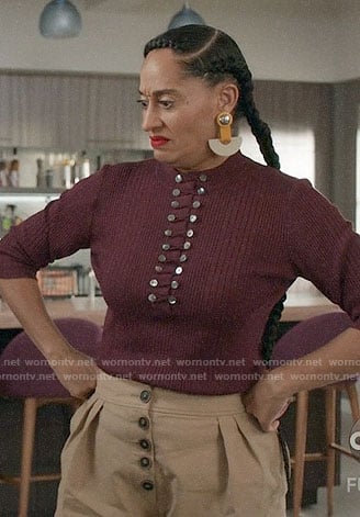 Bo’s burgundy buttoned top and yellow statement earrings on Black-ish