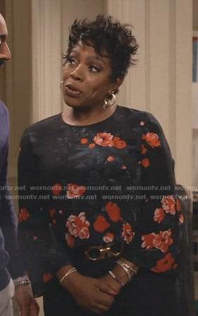 Rose’s black floral bell sleeve top on Fam