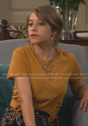Shannon’s yellow lace-up tee on Fam