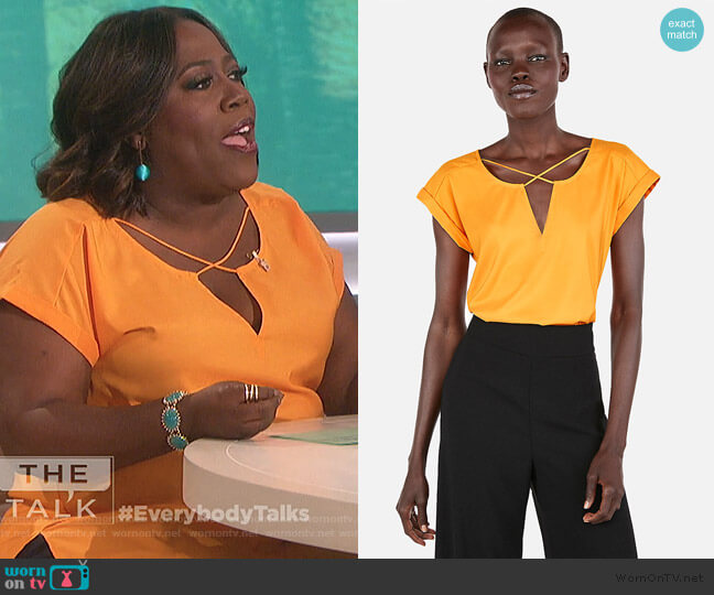 Express Solid Strappy Cross Front Gramercy Tee worn by Sheryl Underwood on The Talk
