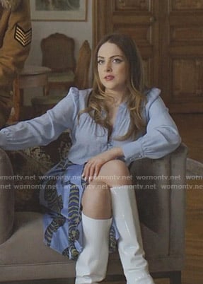 Fallon’s blue blouse and tiger print skirt on Dynasty