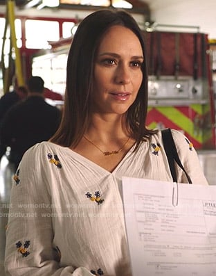 Maddie’s white floral embroidered blouse on 9-1-1