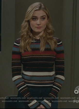 Taylor’s black metallic striped sweater on American Housewife