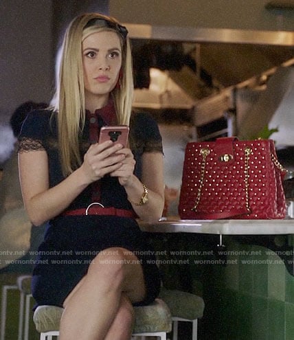 Lucy’s navy lace trim collared dress and studded red bag on Charmed
