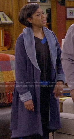 Tina’s black and blue pajamas and blue robe on The Neighborhood