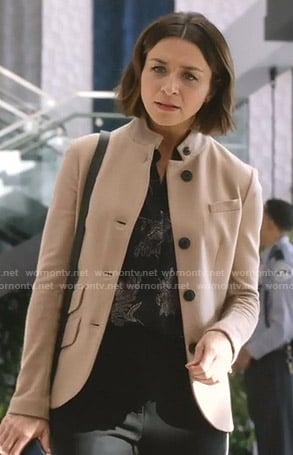 Amelia’s black floral blouse and beige jacket on Grey’s Anatomy