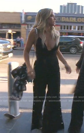 Teddi’s black side button jumpsuit on The Real Housewives of Beverly Hills